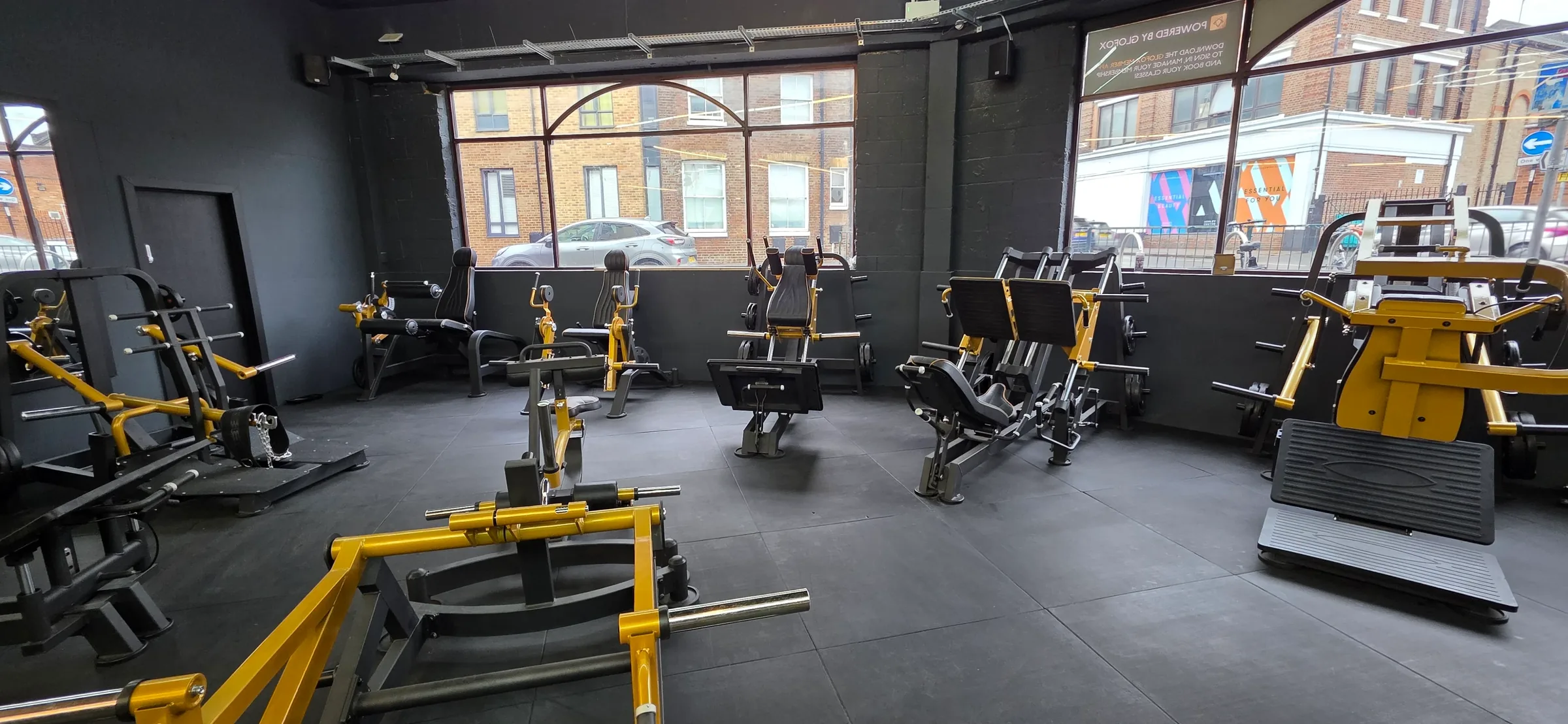 Plate-loaded equipment area at The Rig Gym